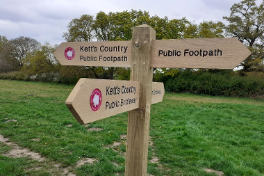 A wooden fingerpost.
