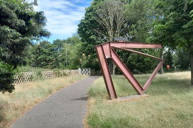 View of the sculpture marking the start of the Marriott's Way route at Barn Road.