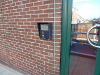 Close up of Plumstead Road Library entrance, showing the 'open library' keypad.