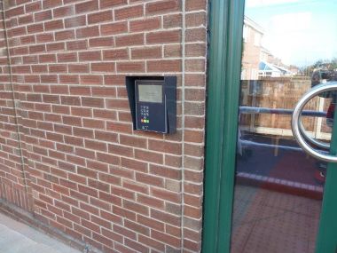 Close up of Plumstead Road Library entrance, showing the 'open library' keypad.
