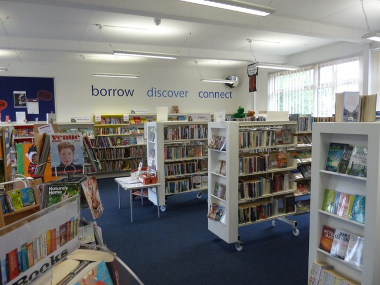 Interior photograph of Harleston library with shelves of books and displays.