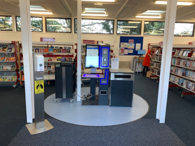 Interior photograph of Costessey Library showing the self-checkout/return facilities.