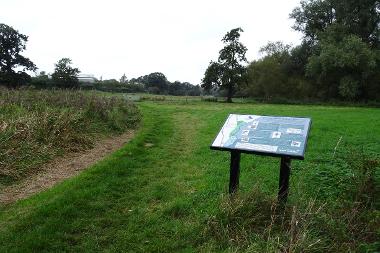 Meadows and an information board at Frenze Beck.