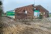 Exterior view of Crusaders Rugby Club with half the roof off and an external wall removed.