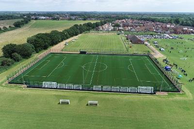 A side on aerial photograph of the 3G artificial grass pitch.