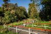 An image of the Marriott's Way at Drayton following the installation of the new ramp. The image shows  a wide angled ramp with red and white handrails.